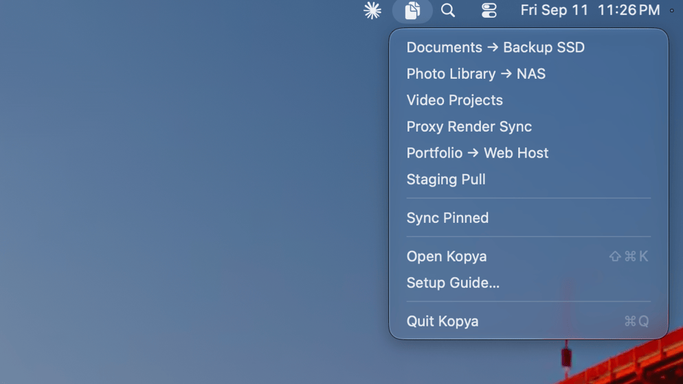 Kopya's menu bar dropdown listing pinned sync jobs, with Sync Pinned and Open Kopya commands.