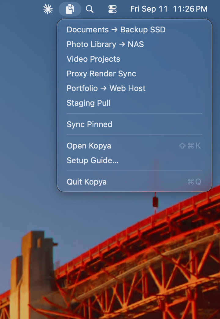 Kopya's menu bar dropdown with pinned sync jobs and their status.